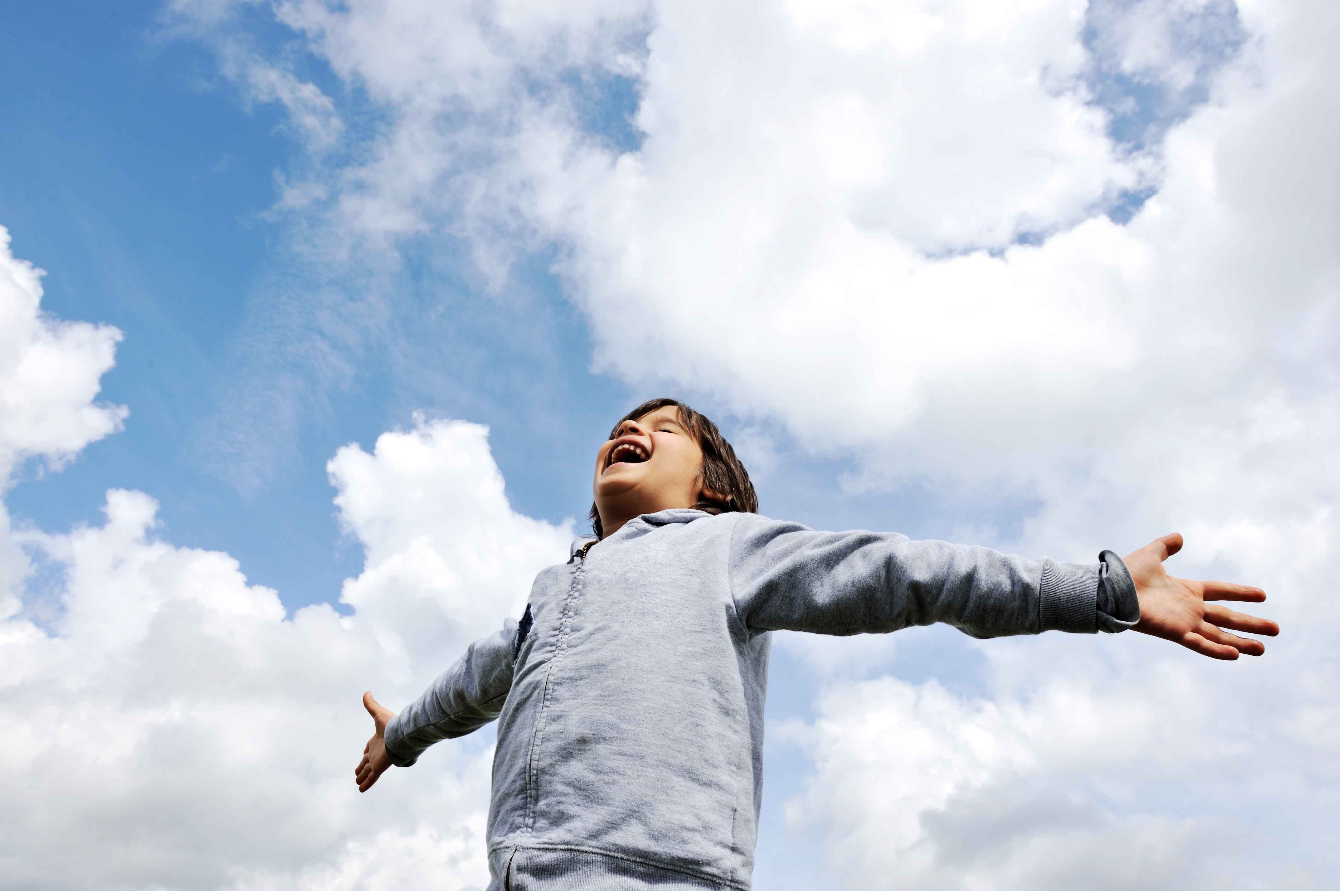Child, freedom, breathing fresh air in nature