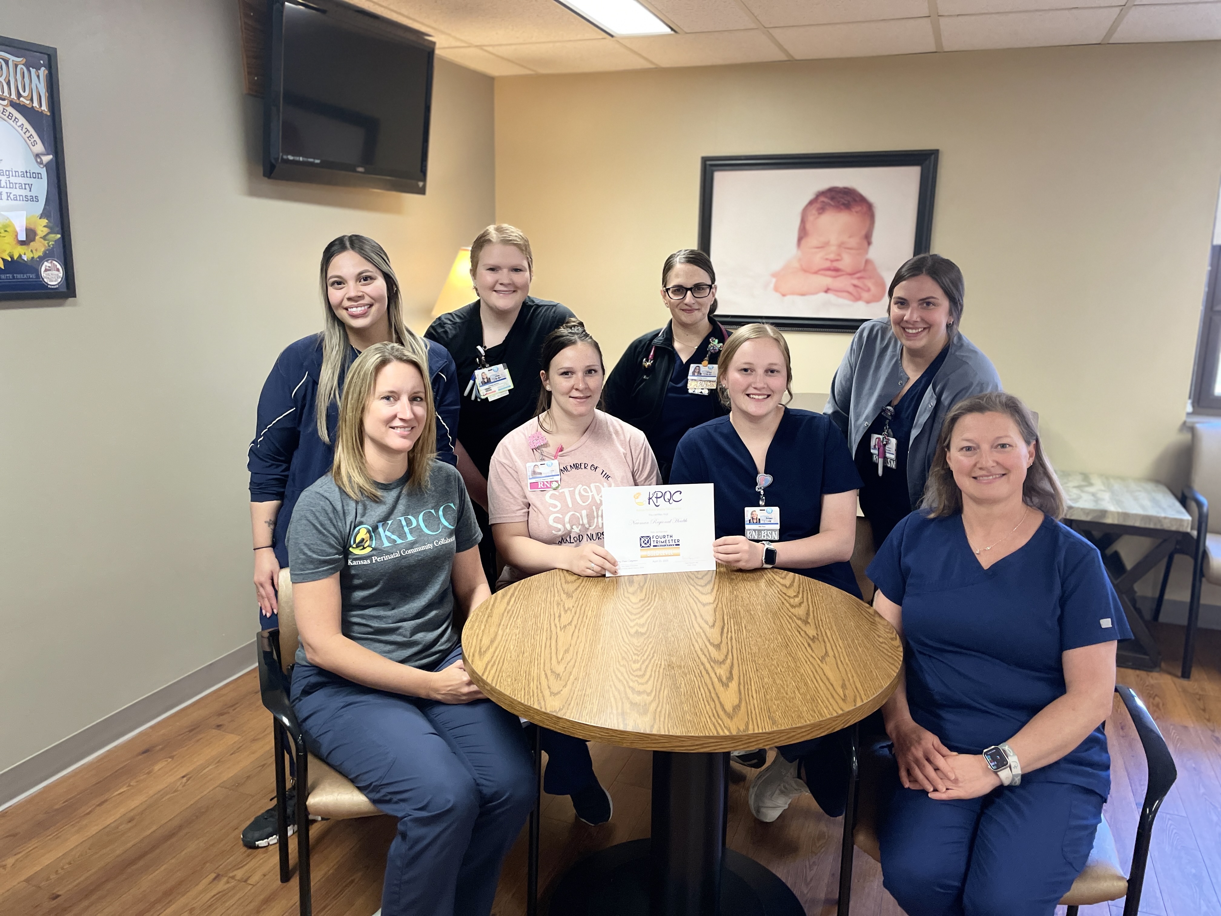 Photo of nurses holding an award for the 4th Trimester Iniative