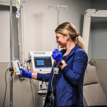 Registered Nurse setting up infusion therapy for a patient in the Infusion Lab at Newman Regional Health